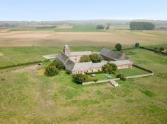 an aerial view of a large farm house