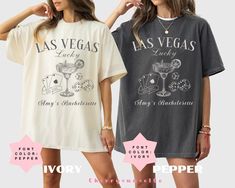 two women wearing las vegas t - shirts and shorts