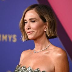 a woman in a strapless dress and diamond necklace at the 2019 tonys awards