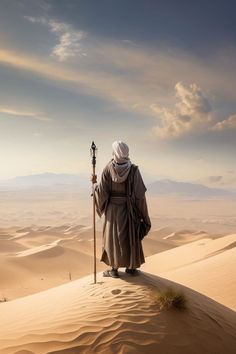 an old man with a staff in the middle of sand dunes, looking out into the distance