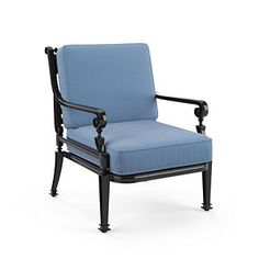 a blue chair sitting on top of a white floor next to a black frame and armrest