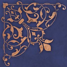 an intricately designed piece of art on a blue background with gold accents and leaves