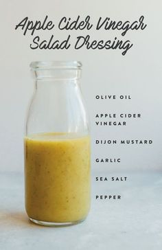 an apple cider vinegar salad dressing recipe in a glass jar with the ingredients labeled