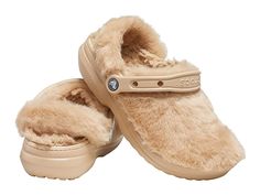 Crocs Classic Fur Sure - Women's Shoes : Chai : The legendary Classic Clog, now with faux-fur fuzz inside and out. Great indoors or out. Incredibly light and easy to wear with slippers-like comfort. Slip-on sandal with classic Crocs oblique toe silhouette. Faux fur lining. Pivoting heel straps for a more secure fit. Customizable backstrap for Jibbitz charms. Dual Crocs Comfort: Blissfully supportive. Soft. Cradling comfort. Easy to clean and quick to dry. Imported. Weight of footwear is based on Crocs Fluffy Slides, Fur Crocs With Charms, Lined Crocs, Crocs Women, Cozy At Home, Classic Slippers, Crocs Clogs, Crocs Classic Clogs, Fuzzy Slippers