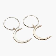 These lunar-inspired Crescent Moon Charm Hoop Earrings add a touch of celestial beauty suitable for both everyday and occasional wear. The crescent shapes evoke mystical and romantic associations often linked with the moon, such as cycles, intuition, and feminine energy. Handmade by our jewellers in Sterling Silver. We make our jewellery using the finest quality 925 Sterling Silver. Minimalist Crescent Hoop Earrings, Minimalist Crescent Hoop Earrings For Everyday, Metal Crescent Hoop Earrings, Crescent Hoop Earrings With Ear Wire, Nickel-free Moon Shaped Hoop Earrings, Nickel-free Moon-shaped Hoop Earrings, Nickel-free Moon-shaped Metal Hoop Earrings, Handmade Metal Crescent Hoop Earrings, Handmade Crescent Metal Hoop Earrings