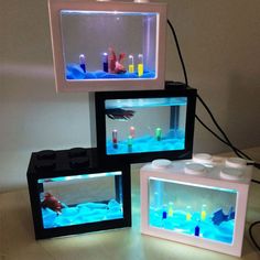 three different types of aquariums sitting on top of a table