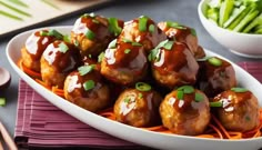 a white plate topped with meatballs covered in gravy and garnished with green onions