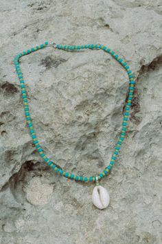 Elevate your beach ensemble with the Elsa Shell Necklace (named after our favourite Ibu). Made from recycled polyester beads, it's a sustainable and stylish choice. Rock it solo or layer it with our Balik Double Beaded Necklace for a vibrant summer vibe. Casual Turquoise Beaded Necklace With Colorful Beads, Casual Turquoise Beaded Necklaces With Colorful Beads, Blue Necklace For Summer Vacation, Casual Turquoise Beaded Necklaces, Coastal Strand Necklace For Summer, Hippie Multicolor Beach Necklaces, Casual Turquoise Beaded Necklace, Summer Coastal Strand Necklace, Summer Shell Necklace For Vacation