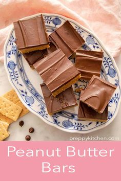 peanut butter bars on a blue and white plate with text overlay that reads, peanut butter bars