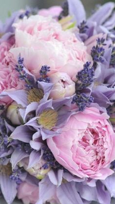 a bridal bouquet with pink and purple flowers