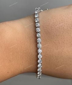 Round Cut Moissanite Diamond Tennis Bracelet 5.50TCW Made In Sterling Silver, 10K/14K/18K Gold & Platinum Gift For Her ♦ Metal: Sterling Silver, 10K/14K/18K Gold, Or Platinum ♦ All Stones: CZ Diamonds/Moissanite ♦ Stone Shape: Round ♦ Stone Cut: Brilliant Round Cut Excellent ♦ Size: 3.00 mm ♦ Color: Colorless ♦ Clarity: VVS1 ♦ Total Carat Weight: 5.50 CT Approx. ♦ Nickel Free, Lead-Free ♦ Occasion: Anniversary, Engagement, Gift, Party, Wedding ✥ O T H E R ∙ I N F O R M A T I O N ✥ ♦ We provide t White Moissanite Diamond-cut Bracelet, Classic White Moissanite Bracelets, White Moissanite Tennis Bracelet As Gift, White Moissanite Bracelet Fine Jewelry, White Moissanite Bracelets Fine Jewelry, White Sterling Silver Bracelet With Prong Setting For Anniversary, Sterling Silver Moissanite Bracelet For Anniversary, White Moissanite Diamond Bracelet, White Moissanite Round Cut Bracelet