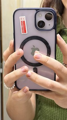 a woman taking a selfie with an iphone case in front of her earring