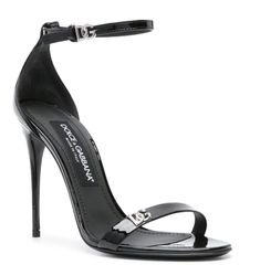 https://www.farfetch.com/ge/shopping/women/dolce-gabbana-logo-plaque-patent-sandals-item-22486842.aspx?storeid=13537 Sleek Leather Sandals With Glossy Finish, Sleek Glossy Leather Sandals, Designer Patent Leather Heels With Heel Strap, Sleek Patent Leather Sandals With Glossy Finish, Sleek Glossy Patent Leather Sandals, Sleek Glossy Open Toe Sandals, Sleek Glossy Finish Open Toe Sandals, Luxury Glossy Evening Heels, Luxury Glossy Finish Heels For Evening