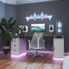 a computer desk with speakers and a monitor on it