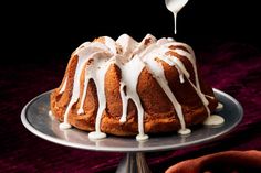 a bundt cake with white icing and drizzled on the top