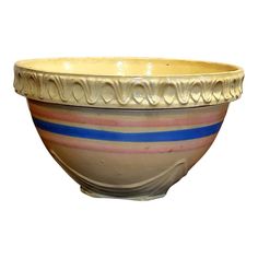 a white bowl with blue and pink stripes on it's rim, sitting in front of a white background