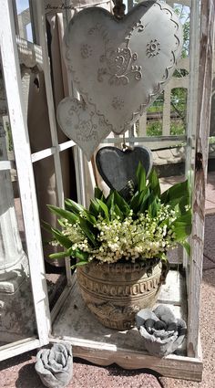 a potted plant sitting on top of a wooden stand