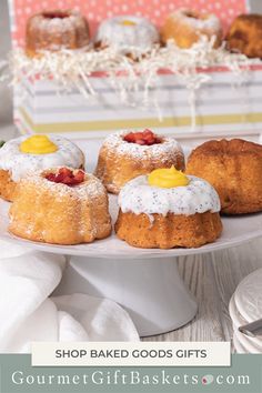 small pastries on a white plate with strawberries and lemons in the background