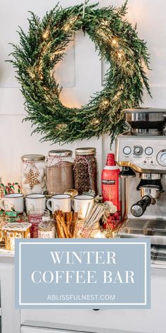 a coffee bar with christmas wreath on the counter and other items around it, including hot chocolates