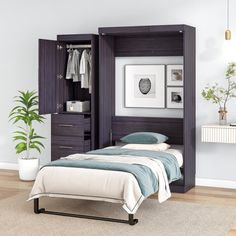 a bedroom with a bed, dresser and closet in the corner next to a potted plant