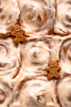 cinnamon roll with icing and ginger cookies on top