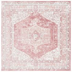 a pink and white rug with an ornate design on the center, in front of a white background