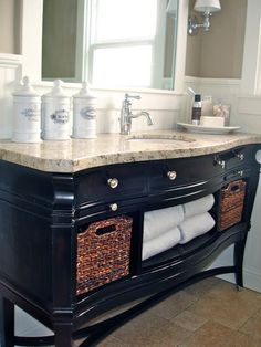 a bathroom vanity with two baskets under the sink