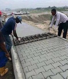 two men working on a cement slab with the caption's saying, simplement