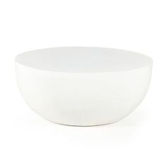 a white bowl sitting on top of a table