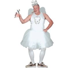 a man in a white dress holding a pair of scissors and wearing a tooth fairy costume