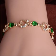 Gold Plated Green Cubic Zirconia & Hearts Bracelet. Measures 8” Inches. Color In Person Looks Most Like First Picture. New Condition And Comes In A Gift Box. Bundle & Save: Bundle 2 Or More Items For A Private Discount Next Day Shipping On All Orders 5 Star Rated Poshmark Ambassador Elegant Green Heart-shaped Bracelet, Wave Bracelet, Crystal Fashion, Heart Chain, Green Crystal, Bangles Jewelry, Colorful Bracelets, Crystal Heart, Diamond Crystal