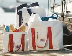 This Sailcloth tote is perfect for the boat, beach or everyday use! The sailcloth tote bag is made from triple layers of cloth on the bottom to make them nearly indestructible. The zipper tops and waterproof lining to keep contents clean and dry. The nautical style bag is sized to be just right for carrying to and from the boat, with a handle long enough to sling over your shoulder. They have plenty of pockets on the inside for keys and sunglasses and a zippered pocket on the outside. Personaliz White Nautical Bag For Everyday, Nautical White Canvas Bags, White Nautical Canvas Bag, White Nautical Canvas Bags, Rectangular Sail-colored Beach Bag, Nautical Sail-colored Bag For Daily Use, Nautical Sail Color Bag For Daily Use, Nautical Style Sail Color Bags For Daily Use, Nautical Style Sail-colored Bag For Daily Use