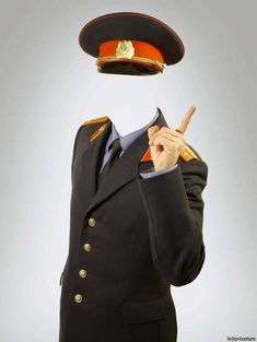 a man in a suit and hat is making the peace sign with his hand while wearing an orange beret