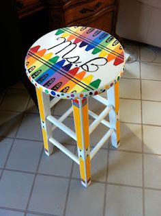 a stool that has been painted with different colors