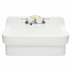 a white sink with two faucets on the front and one faucet in the back