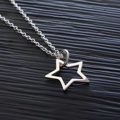 "Sterling Silver Star Pendant Outline Necklace, Patriotic Star Necklace, Celestial Zodiac Star Jewelry, Lucky Star Birthday Charm Necklace, FREE SHIPPING Brilliant and high polished, this 925 sterling silver star pendant necklace has a simple open work design. Choose from several chain options to make it special gift to give or a versatile accessory for yourself. OVERVIEW: * Beautiful, elegant, bright and sturdy 14, 16, 18, 20, or 22 inch 925 sterling silver chain. Choose from a 0.7 mm 925 sterl Silver Jewelry With Star Print As Gift, Silver Star Print Jewelry As Gift, Silver Jewelry With Star Print For Gift, Silver Star Print Jewelry For Gift, Silver Star Print Necklace, Silver Necklace With Star Print For Gift, Silver Star Print Necklace Perfect For Gift, Silver Star Print Necklace For Gift, Silver Star-shaped Jewelry For Birthday