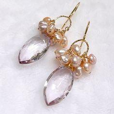 "Sophisticated dangle earrings featuring Pink amethyst & pink keshi Edison pearls. Gold filled findings. Genuine Pink amethyst marquise briolettes are 10x20mm. Handmade in Hawaii. Earrings total length is approximately 1.25\" including ear wires." Elegant Pink Amethyst Earrings, Pink Briolette Earrings With Natural Stones, Pink Briolette Natural Stone Earrings, Pearl Briolette Earrings, Elegant Amethyst Earrings With Pearl Drop, Elegant Amethyst Pearl Drop Earrings, Pink Briolette Earrings For Wedding, Briolette Pearl Earrings With Gemstone For Wedding, Wedding Briolette Pearl Earrings With Gemstone