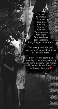 a man and woman walking down a street next to each other with a poem written on it