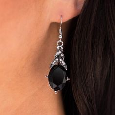 A faceted black gem swings regally from a white rhinestone encrusted frame. The glamorous display falls flawlessly from the ear in a refined fashion. Earring attaches to a standard fishhook fitting. Sold as one pair of earrings. Lead and Nickel Free. Refined Fashion, Black Gems, White Rhinestone, Black Earrings, Fish Hook, Gems, Black