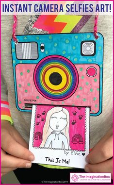 a person holding up a camera with the words instant camera selfies art on it