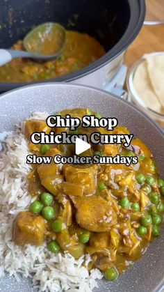 a bowl filled with rice, peas and chicken curry next to a pot of tortilla chips