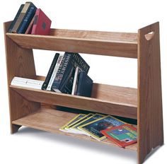 a wooden book shelf with books and magazines on it's sides, against a white background