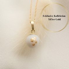 We create an enchanting piece of jewelry from your breast milk as a reminder of the beautiful time of breastfeeding. IN OUR EXCLUSIVE COLLECTION YOU WILL FIND JEWELRY MADE OF SOLID GOLD. The 8 mm large pearl looks particularly elegant, the pendant loop and the pearl cup are made of 585 yellow gold. We would be happy to incorporate hair into the pearl. You are only buying the pearl including the pendant loop and the pearl cup, both made of 585 yellow gold. For a 585 yellow gold chain, please cont White Round Pendant Jewelry Gift For Her, White Hypoallergenic Round Pendant Jewelry, Hypoallergenic White Round Pendant Jewelry, White Pearl Charm Jewelry Gift For Her, White Pearl Charm Jewelry As A Gift For Her, White Birthstone Round Pendant Jewelry, White Jewelry With Birthstone For Keepsake, White Birthstone Jewelry For Keepsake, Pearl White 14k Gold Jewelry Gift