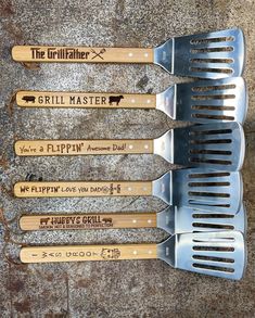 four grilling utensils with the words grill master written on them are lined up next to each other