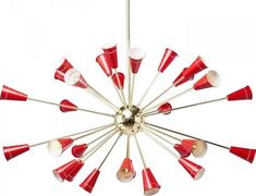 a chandelier with red and white lights hanging from it's center point