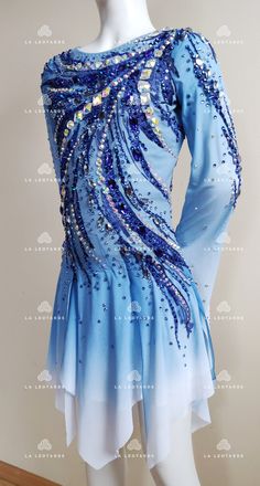 a blue and white dress with sequins on it