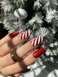 Shown in medium square  red glitter under a 3D matte peppermint design  nail glue included. Prep kit sold separately Mat Christmas Nails, Peppermint Nail Designs, Christmas Nails Candy Cane Stripes, Red Silver Nail Designs, Glitter Candy Cane Nails, Peppermint Christmas Nails, Matte Red Christmas Nails, Pink Peppermint Nails, Peppermint Nail Art