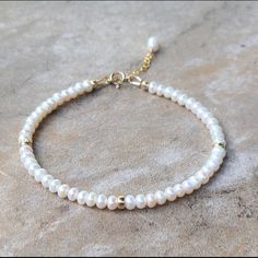 Freshwater Pearl Bracelet Item Description ********************** Handmade In Usa Freshwater Pearls, 4mm 14k Gold Filled Rondelle, 4mm 14k Gold Filled Spring Ring Clasp, 5.5mm 14k Gold Filled Extended Chain, 1 Inch Pearls Are 100% Genuine Made To Order In Sterling Silver Length 6.5”+1” Inch Extender Chain ( Custom Length Is Available ) White 14k Gold Filled Jewelry For Anniversary, Elegant White Pearl Bracelet In 14k Gold, Minimalist 14k White Gold Bracelets, Minimalist 14k Gold White Bracelet, Minimalist White 14k Gold Bracelets, White Round Beaded Single Strand Bracelet, White Single Strand Round Bracelet, Delicate White Pearl Bracelet For Anniversary, White Round Single Strand Bracelet