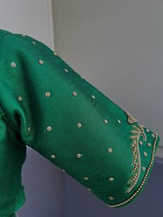 Green Color Raw Silk Readymade Blouse with beautiful Handwork Work in beads and Zircon. Item : Readymade BlouseReady-to-Wear : YesSize : 36 (Can be opened to Size 40)Color : Bottle Green Blouse Fabric : Raw Silk Lining : Yes, it is fully lined Padded or Non-Padded : PaddedClosure: Front Closure with hooks.Disclaimer - : -This is a Standard Size blouse. We do not guarantee perfect fit as every body and shape is different. Little or no alteration would be required to get the perfect fit. - Color v Long Sleeve Blouse With Pearl Embroidery For Wedding, Long Sleeve Wedding Blouse With Pearl Embroidery, Elegant Green Blouse For Festive Occasions, Festive Long Sleeve Blouse With Pearl Embroidery, Elegant Green Festive Blouse, Elegant Green Top For Wedding, Elegant Green Blouse Piece With Dori Work, Elegant Festive Tops With Dori Work, Formal Festive Blouse With Pearl Embroidery