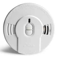 the kiddle fire alarm is white and has buttons on each side that indicate it's time